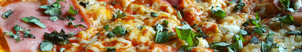 Eating Italian Pizza at Specks Deli & Gourmet Pizza / Keto Kup Coffees restaurant in Huntingdon, PA.